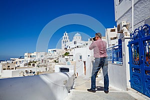 Man photographs  island of Santorini