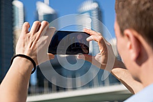 A man photographs local attractions