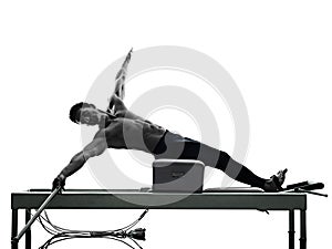 Man pilates reformer exercises fitness isolated