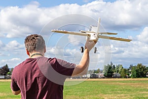 Man piloting a radio remote controlled airplane