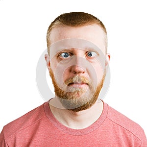 Man in a pink shirt with a sidelong glance photo