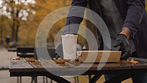 A man placing fast food on the table