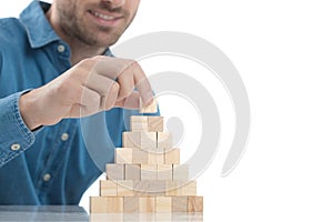 Man placing the last brick