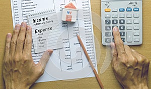 Man Planning monthly income and account expenses