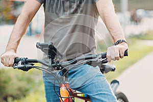 Man planning route using GPS navigation application in mobile phone on his bicycle bike.