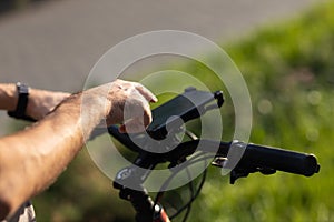 Man planning route using GPS navigation application in mobile phone on his bicycle bike.