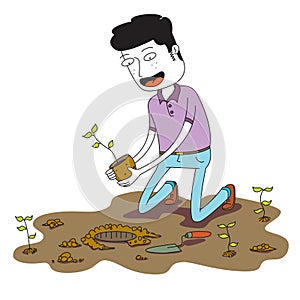 Man plants a small plant on the ground