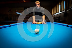 A man plasy Pool Billiard