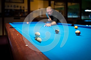 A man plasy Pool Billiard