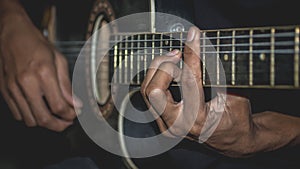 Man playing acoustic guitar