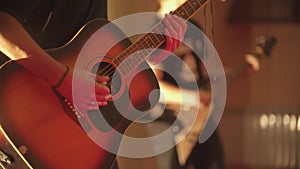 A man playing acoustic guitar - a band performance in the club