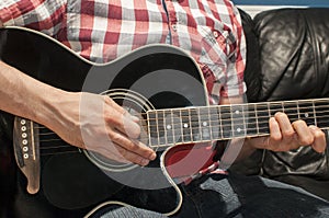Man playing acoustic guitar