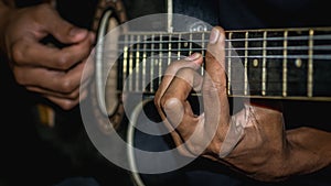 Man playing acoustic guitar