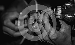 Man playing acoustic ukulele