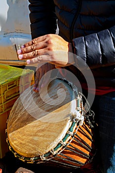 A man playing African Drum Djembe