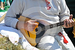 Man playing the balalaika