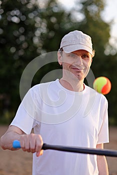 Man playing beach tennis