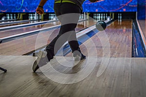 Man playing bowling seen from the back