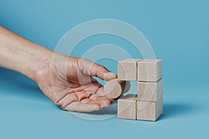 Man is playing with building blocks photo