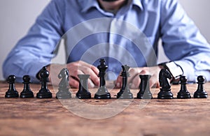 Man playing chess. Competition strategy concept