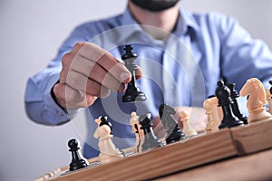 Man playing chess. Competition strategy concept