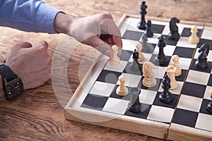 Man playing chess. Competition strategy concept