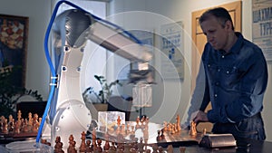 Man playing chess with a robot chessplayer.