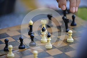 Man playing chess on a table outdoor