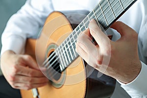 Man playing on classic guitar