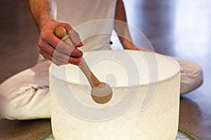 Man playing crystal bowl healing music