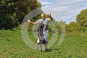 Man is playing with dog