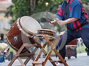 Man Playing Drums of Japanese Musical Tradition during a Public Outdoor Event