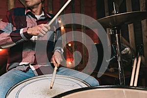 Man playing drums on stage during concert