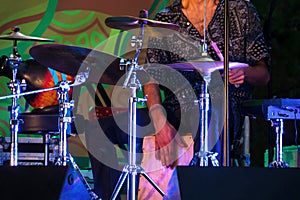 Man playing drums on stage of ethnic open air concert