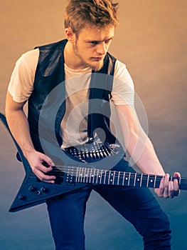 Man playing on electric guitar