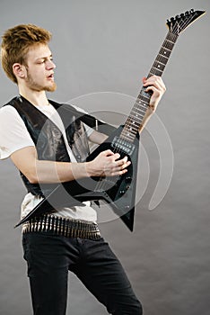 Man playing on electric guitar