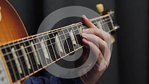 Man playing on electric guitar. Professional guitar solo. Musician performing jazz or blues. Guitarist playing lyric song on guita
