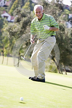 Man Playing A Game Of Golf