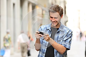 Man playing game with a smart phone