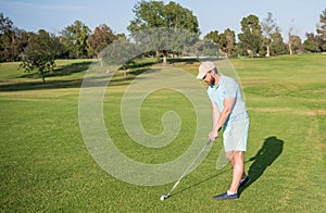 man playing golf game on green grass, copy space, golf player