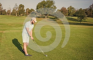 man playing golf game on green grass, copy space, golf player