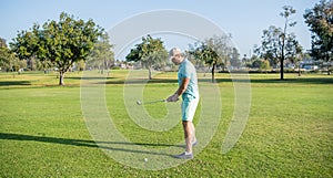 man playing golf game on green grass, sport