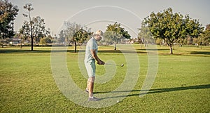 man playing golf game on green grass, sport