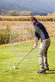 Man playing golf