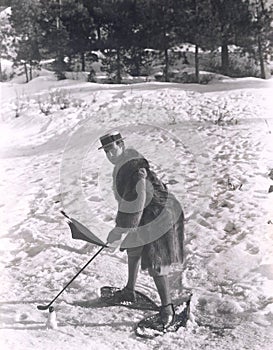 Man playing golf in the snow photo