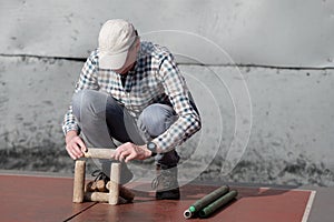 Man playing gorodki, the ancient Russian folk sport