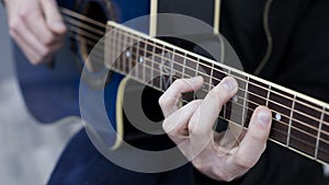 Man playing guitar chord in C major
