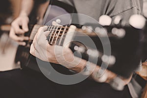 Man playing guitar close up