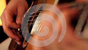 man playing guitar close up 3