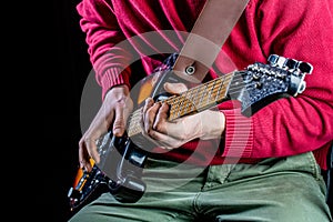 Man playing guitar. Close up hand playing guitar. Musician playing guitar, live music. Musical instrument. Electric